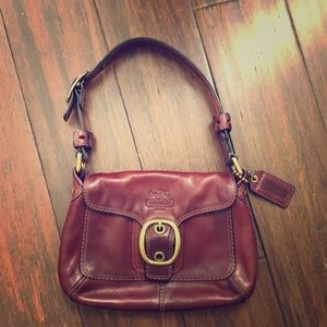 Small reddish/burgundy Coach purse